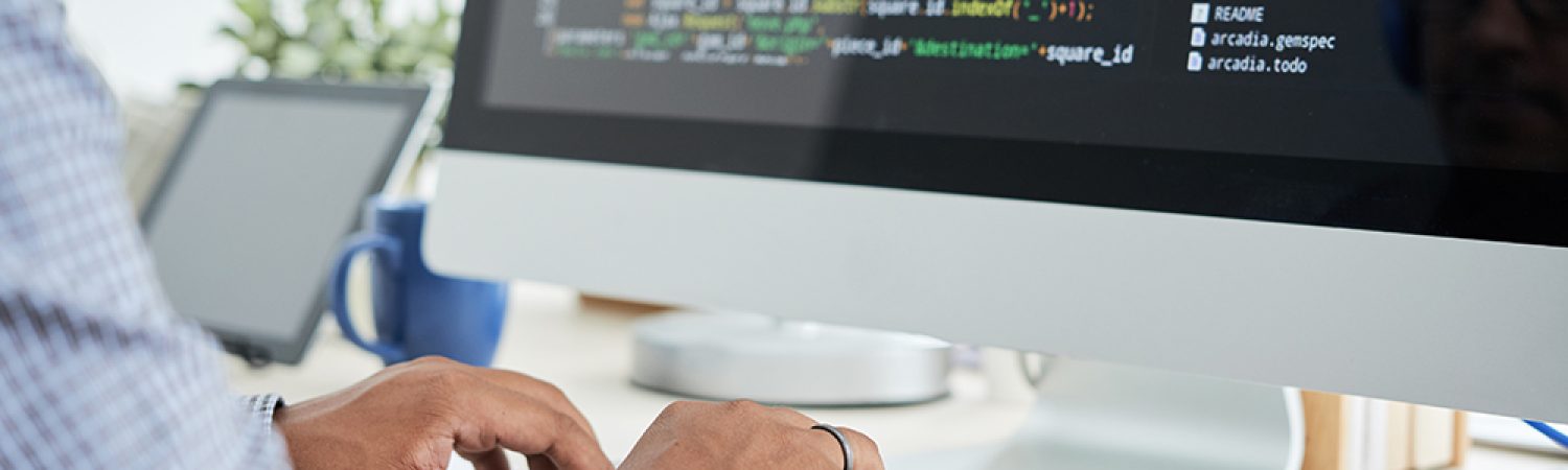 Coding man Cropped image of It specialist working on code